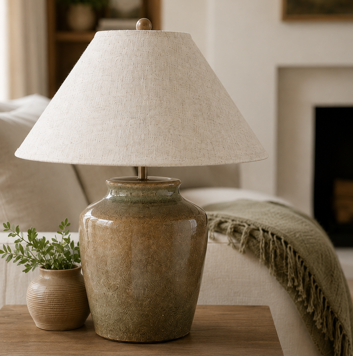 image of mottled green lamp with linen shade on living room side table